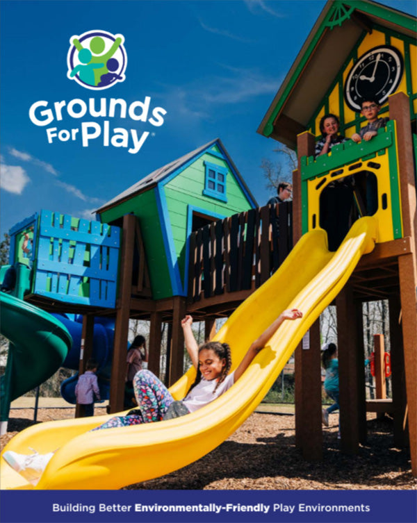 children playing on playground and sliding down a yellow slide