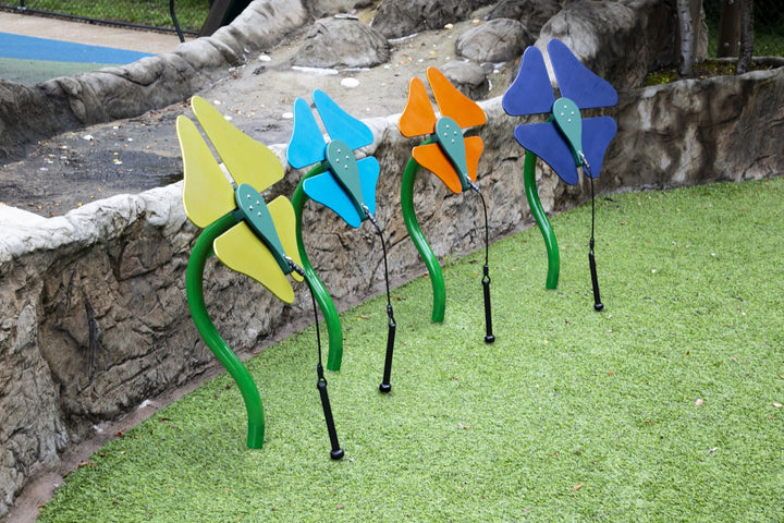 4 flower instruments in a park