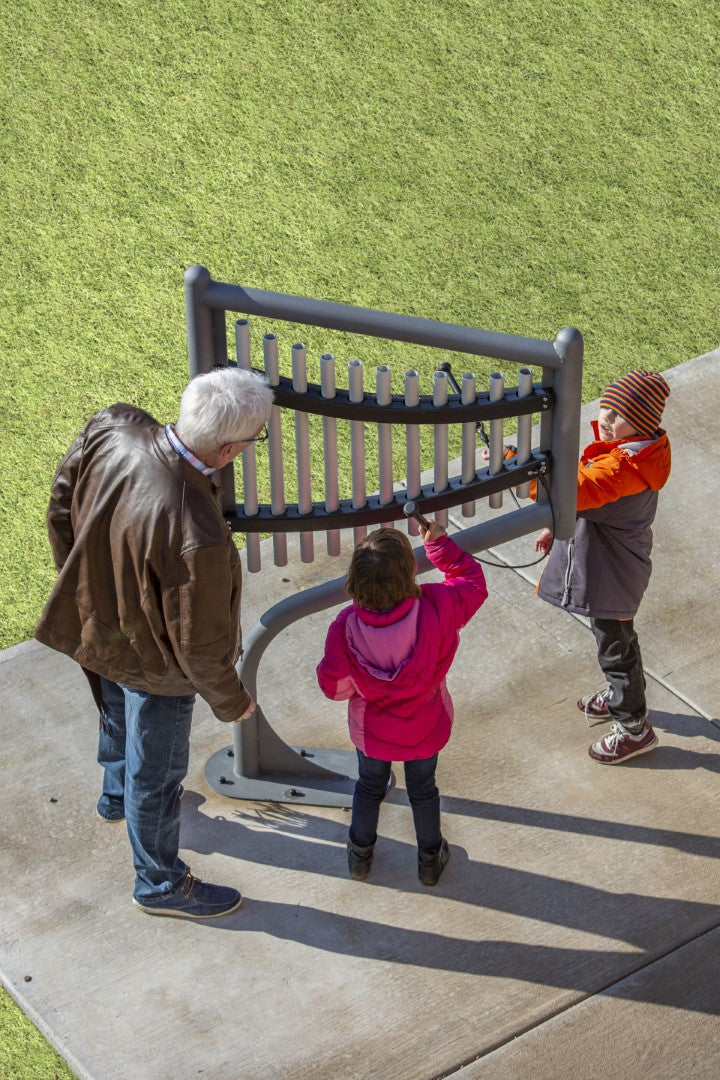 grandchildren playing the harp instrument with their grandfather