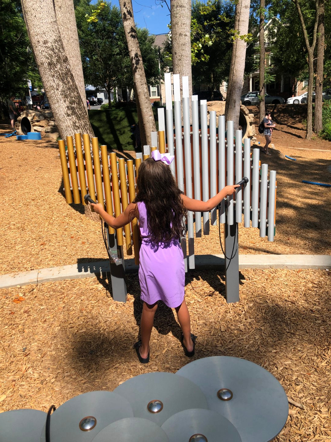 young girl playing with the swirl instruments