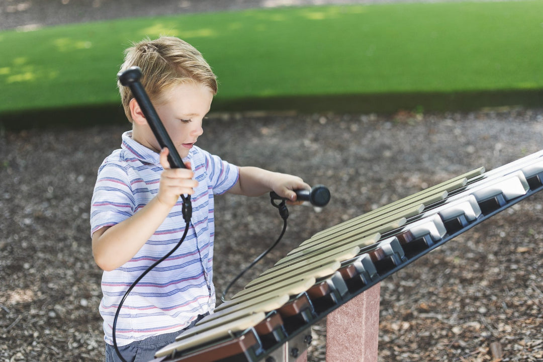 Young boy playing piper instrument