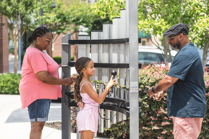 a family playing Titan Tines instrument