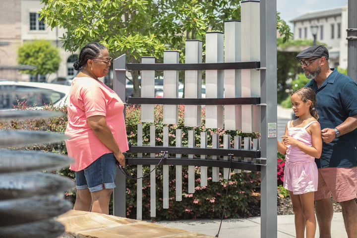 a family playing Titan Tines instrument