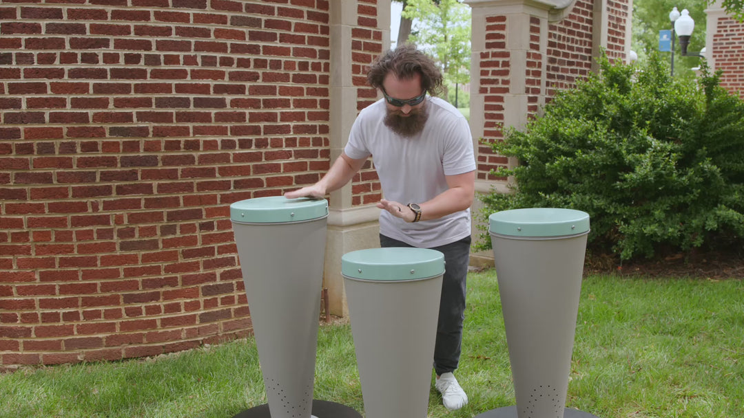 A man playing three freenotes drums